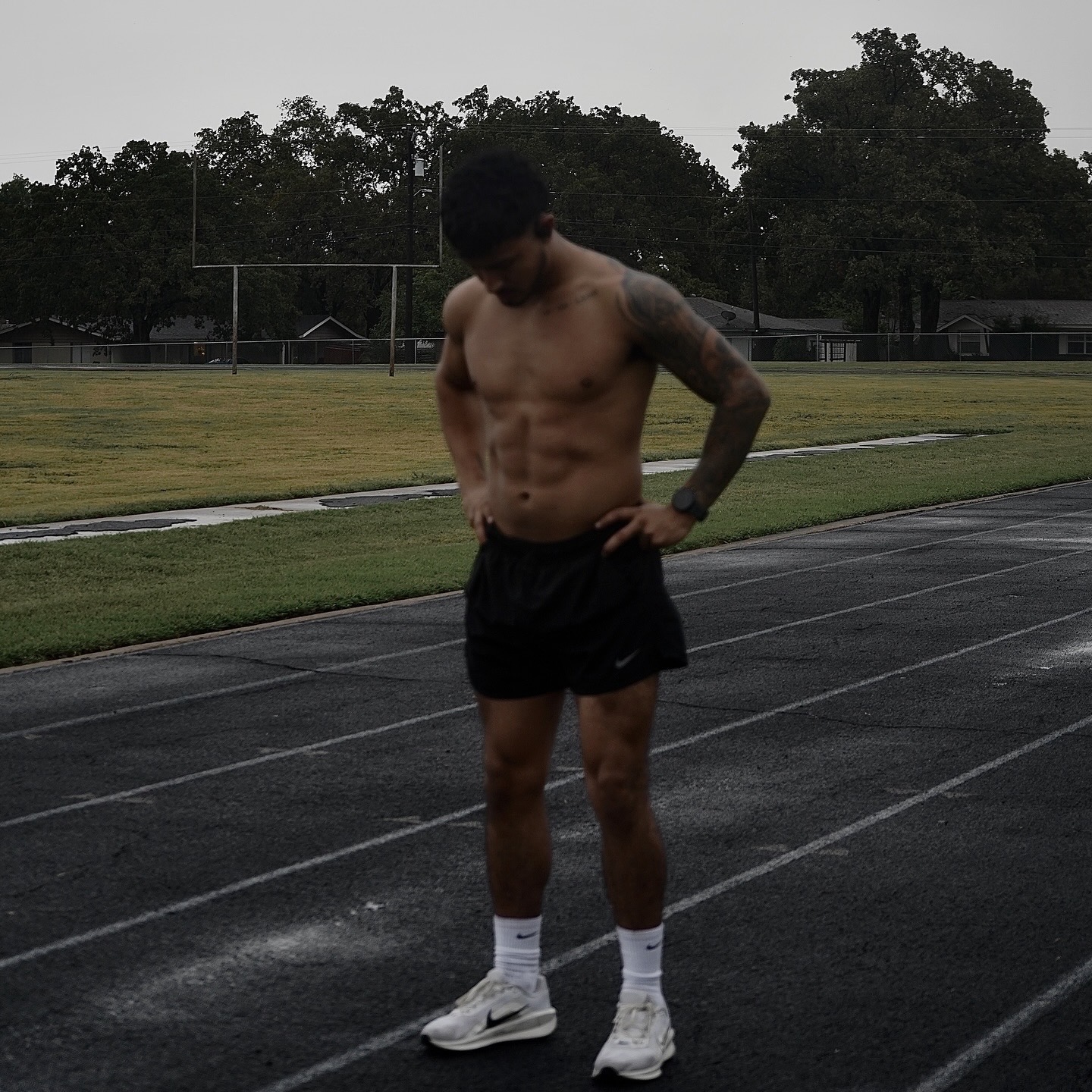 Nabian standing on a track after training